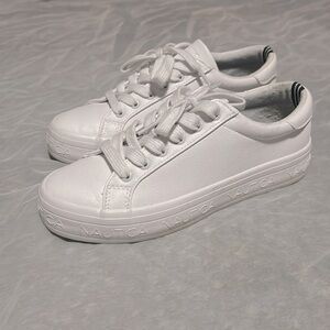 All white Nautica sneakers. Women’s size 6 1/2.